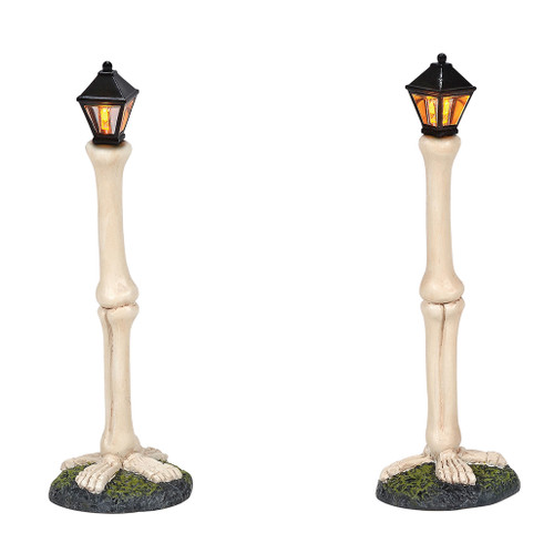 Set of 2 street lights for your Village display. Giant bones and tiny boned feet add a skeleton feel to your Village. This lighted accessory is hand-crafted, hand-painted, resin. Battery box included, 2 C batteries required.