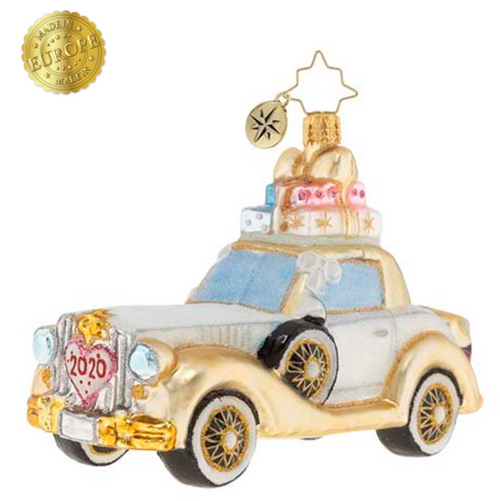 The happy couple takes off after their wedding in this wedding bliss chariot! Their gifts stacked high atop the roof and their bags packed for a honeymoon of memories at the back, this loving couple is ready for their happily ever after!