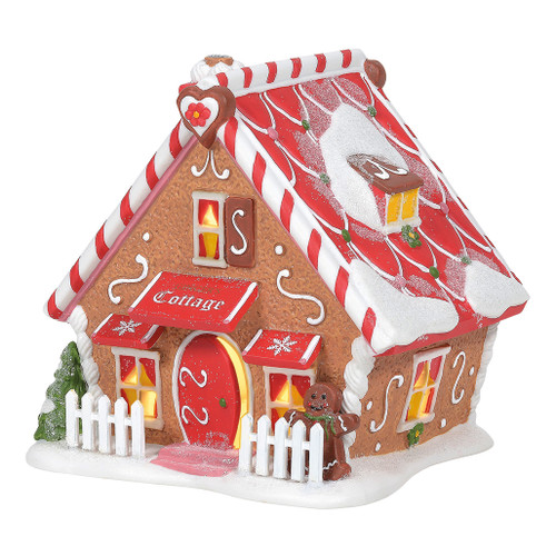 Magical elves have built a sweet neighborhood inspired by the gingerbread houses they create for Christmas. Ginger's Cottage includes peppermint trim, scrolled icing, and an oversized gingerbread man to turn up the charm on this cozy A-frame.