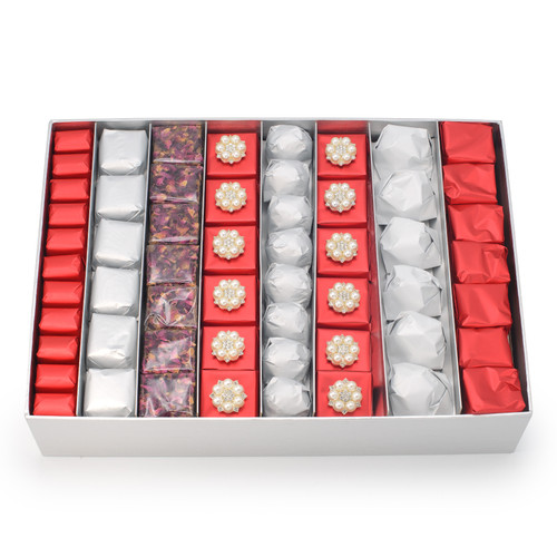 Alternating rows of red, silver with two rows of decorated red chocolate with 6 pearl