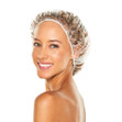 A woman wearing a plastic hair processing cap.