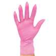 A hand wearing a Colortrak Pink Vinyl Glove.