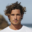 A man with wavy styled hair.