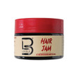 A beige tub of Level 3 Hair Jam with a red screw top lid. A beige tub of Level 3 Hair Jam with a red screw top lid.