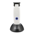 StyleCraft White Saber Trimmer in the included charge stand.