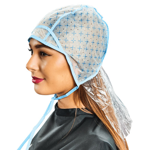 A woman wearing a blue and white tipping cape with an x pattern. A woman wearing a blue and white tipping cape with an x pattern.