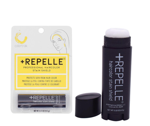 A white and yellow package next to a small black tube of Colortrak Repelle+.