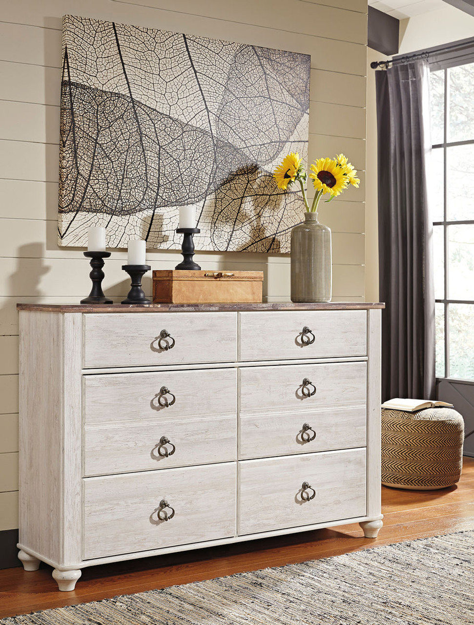 The Willowton Brown / Beige / White Six Drawer Dresser is available at  Discount Furniture Center proudly serving South Hill and Farmville, VA and  surrounding areas!