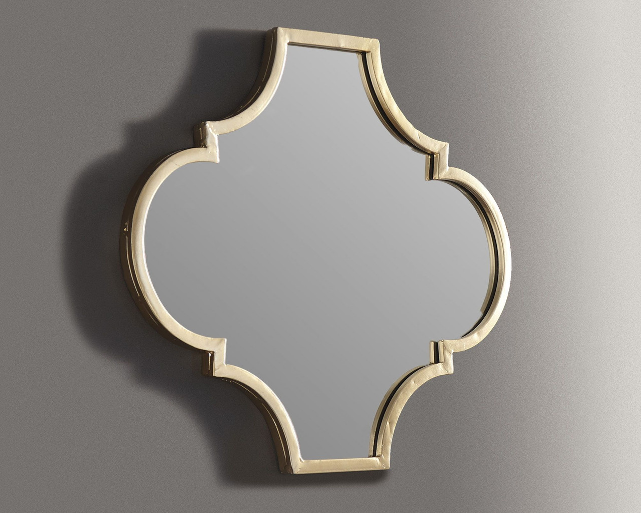 The Callie Gold Finish Accent Mirror is available at Discount Furniture