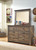 Trinell Brown 8 Pc. Dresser, Mirror, King Poster Bed, 2 Nightstands