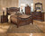 Leahlyn Warm Brown 7 Pc. Dresser, Mirror, King Panel Bed, 2 Nightstands