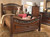 Leahlyn Warm Brown 7 Pc. Dresser, Mirror, King Panel Bed, 2 Nightstands