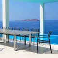 Cane-line Edge armchairs around Edge dining table.