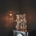 Placed in a glass jar - Galaxy - Silver, battery LED lights by Lightstyle London.