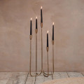 Small - Mbata cluster candelabra with lit candles.