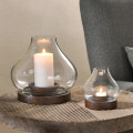 Large and small Naryla lanterns with lit candles.