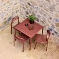 Bliss square dining table and Bliss chairs in Desert Red.