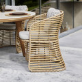 Cane-line Basket chair in Natural with white cushion.