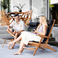 Cane-line Flip deck chair with people seated.