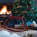 Chili - Rocking Horse by Christmas tree indoors.