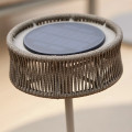 Close-up of solar LED lamp on Taupe - Small Illusion lamp.