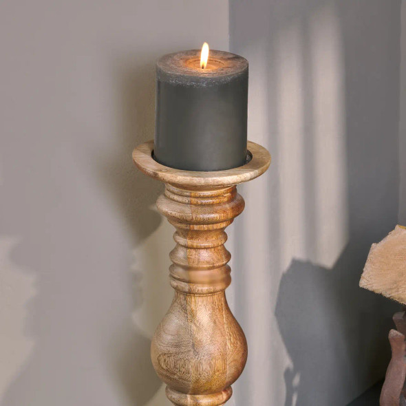 Akello Candle Stick close-up photo with grey candle lit.