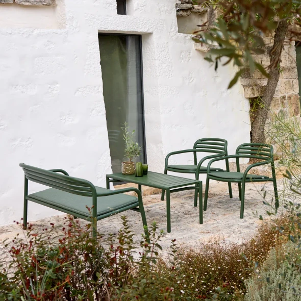 Bliss sofa and armchairs with seat cushions and the coffee table in Dark Green.