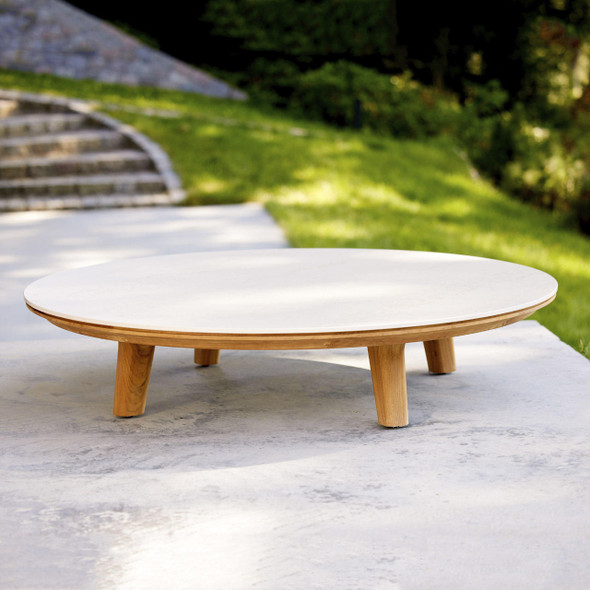 Cane-line Aspect coffee table 144cm diameter with a Travertine look table top.