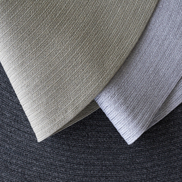 Cane-line circle rugs in Taupe and Light Grey close-up.