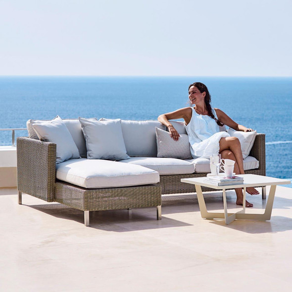 Cane-line Connect chaise lounge cushion in White by the sea.