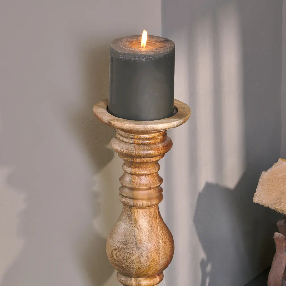 Akello Candle Stick close-up photo with grey candle lit.