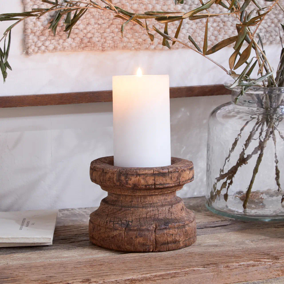 Lit candle situated in the Thoko Round Candlestick.