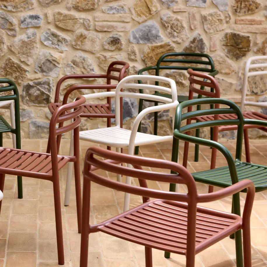 Bliss chairs and armchairs in Desert Red, Dark Green and Sand.