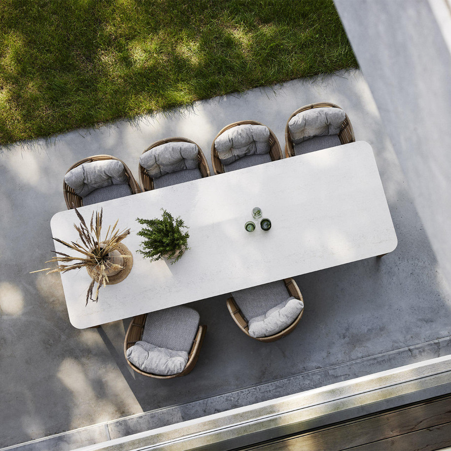 Cane-line Aspect 280x100 cm dining table in Travertine Look with chairs.