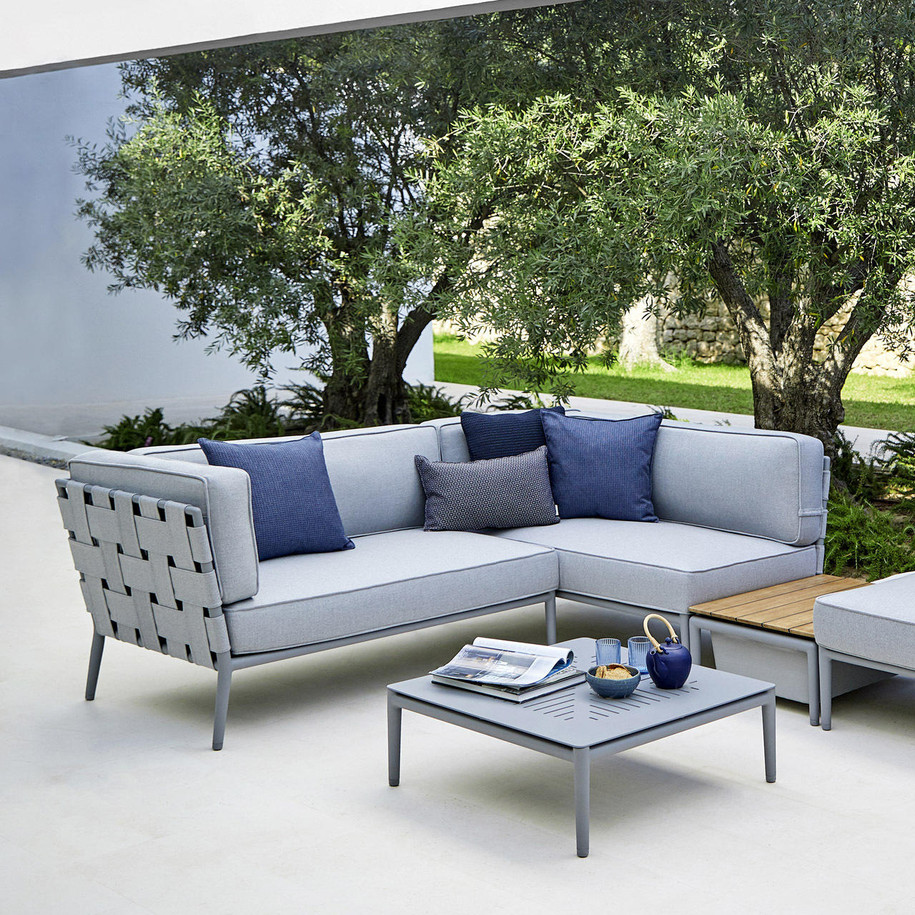 Cane-line Conic coffee table in Light Grey with modular sofas.