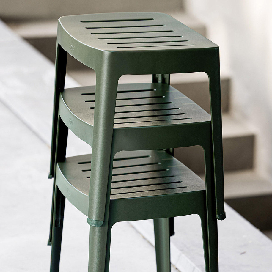 Cane-line Cut stackable stools in Dark Green.