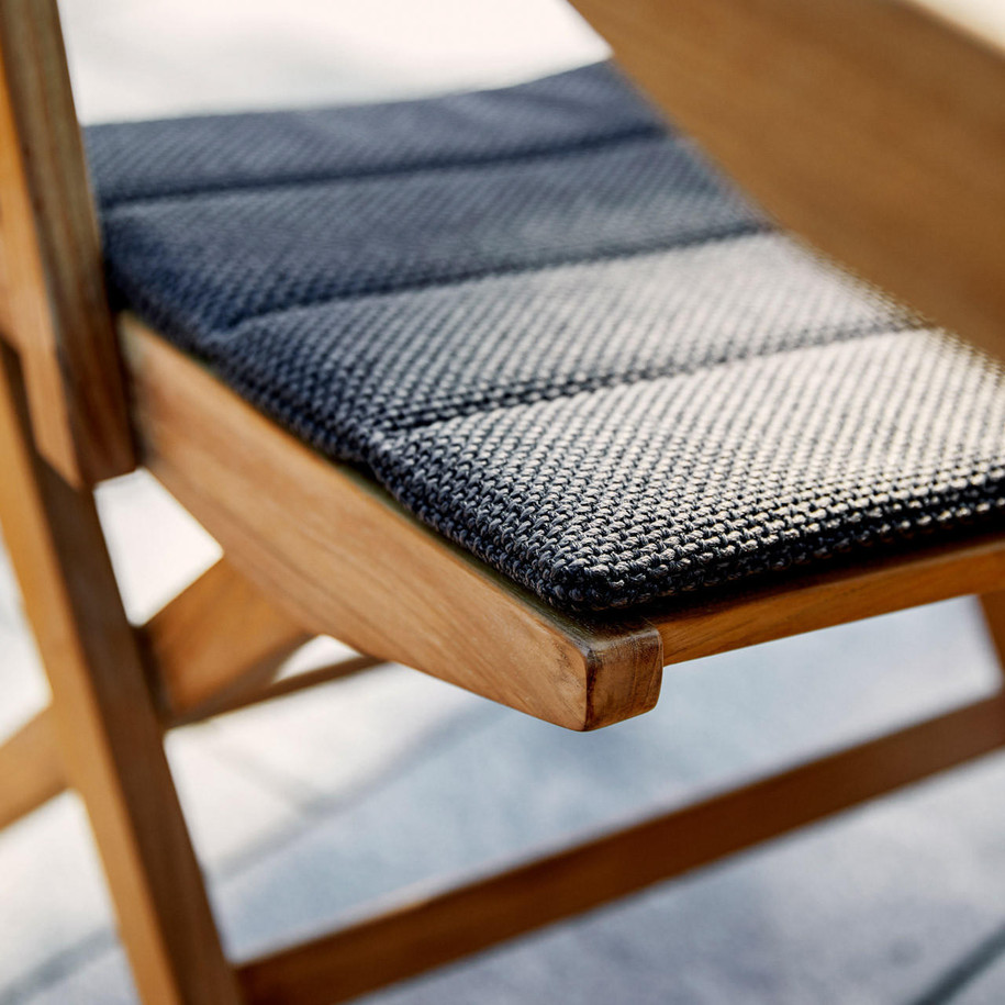 Cane-line Flip folding armchair close-up detail.