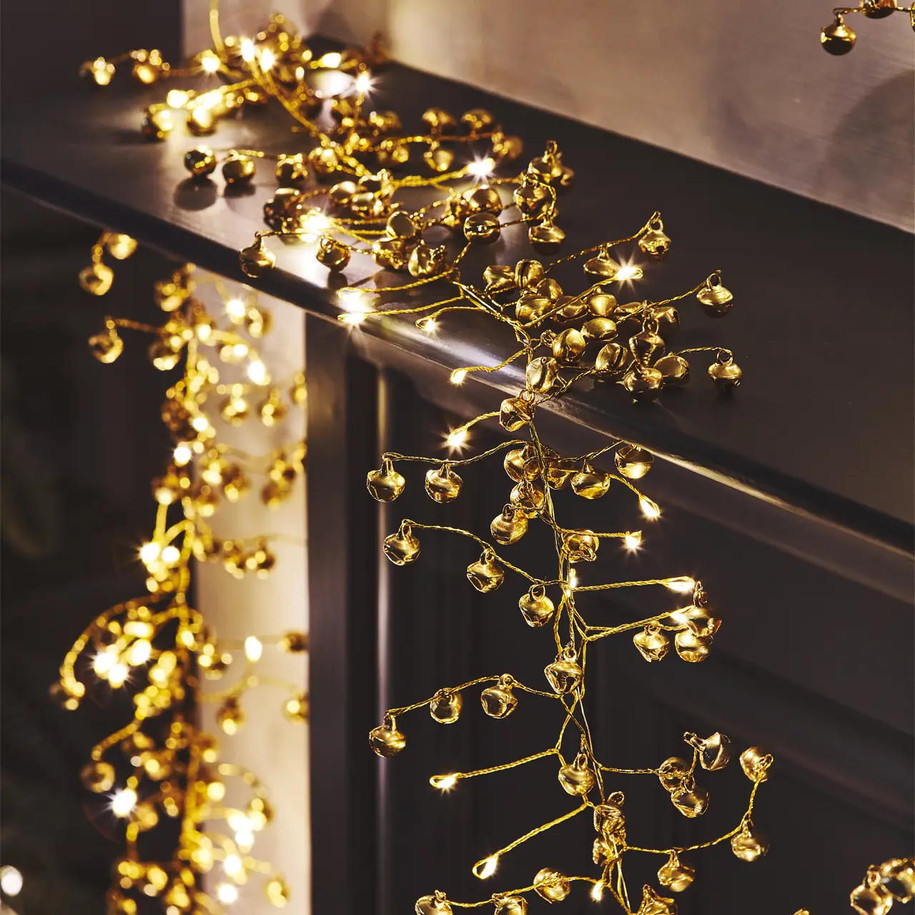 Lightstyle London Golden Bells warm white LED Lights on fireplace.