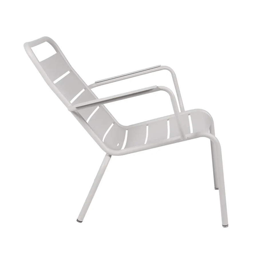 Side profile of the Cotton White Luxembourg Low Armchair by Fermob.