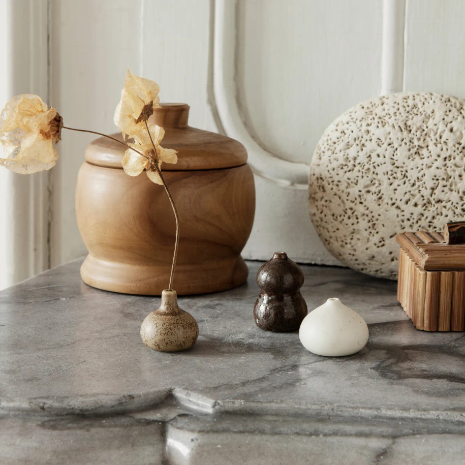 The trio of Komo Mini Vases on a countertop.