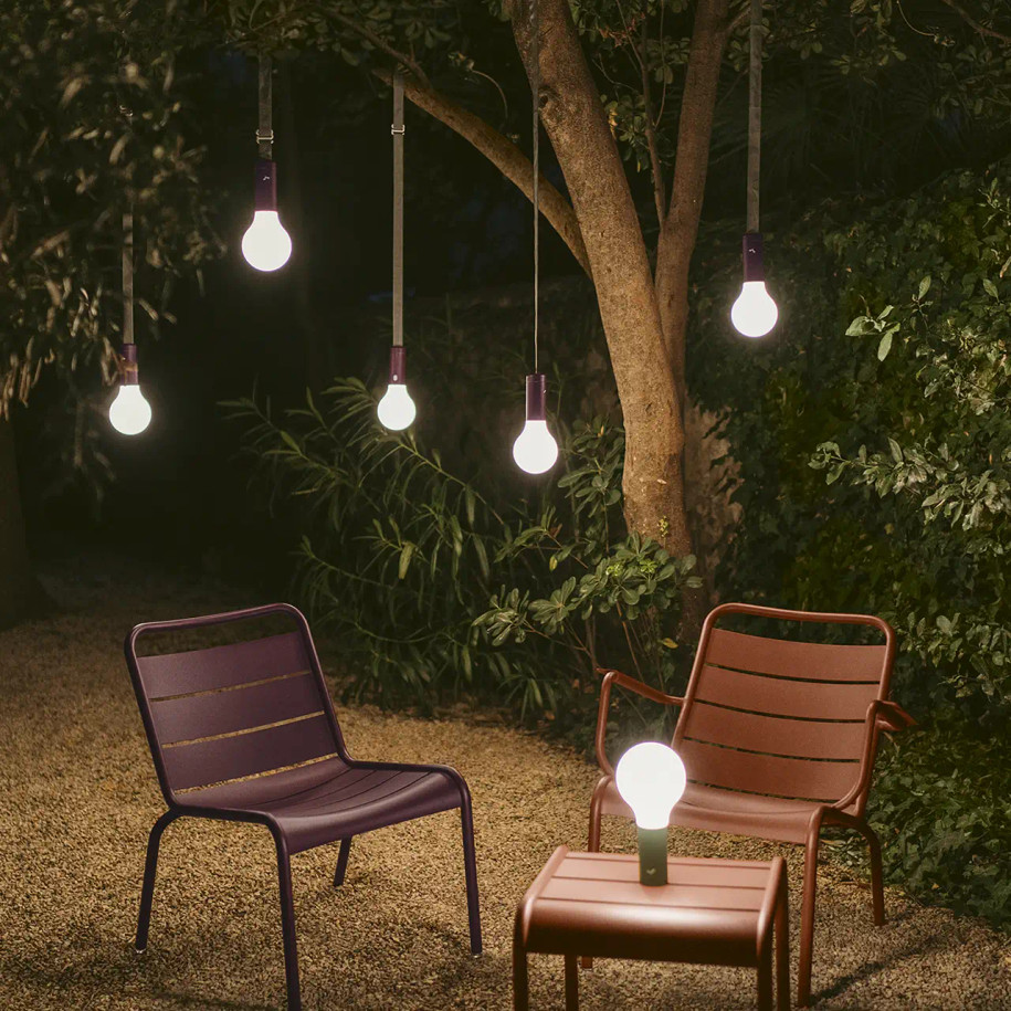 Black Cherry - Aplo lamps with suspension straps hanging from tree.