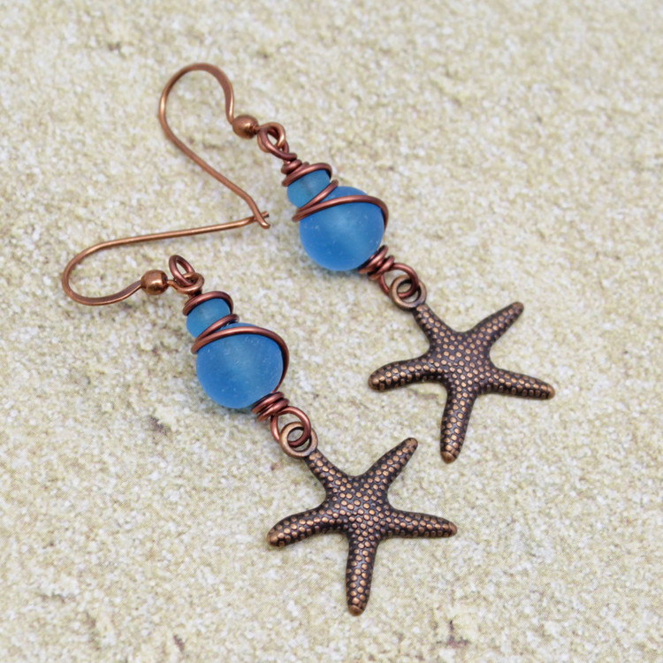 copper starfish earrings with blue sea glass