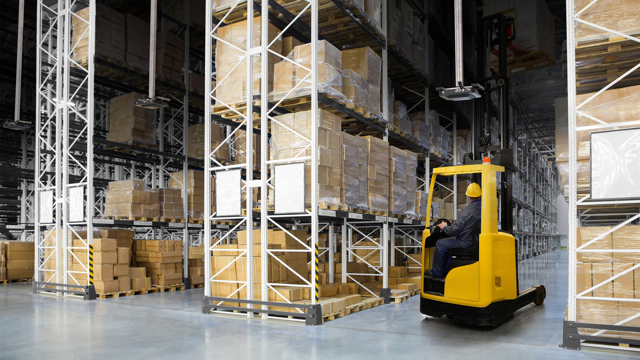 Zebra FXR90 fixed RFID reader tracking tagged inventory in warehouse aisles