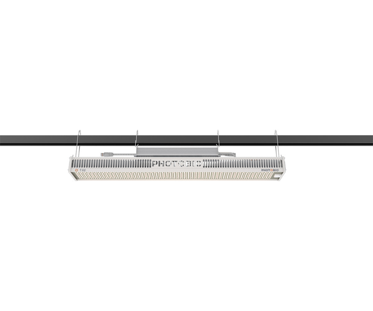 PHOTOBIO TX2 LED grow light suspended horizontally, featuring an array of diodes and a silver heatsink.
