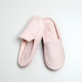 Pink closed-toe house slippers arranged as a pair