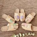 Natural linen house slippers styled for home