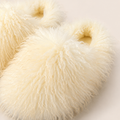 Yellow shaggy plush house slipper texture and opening detail
