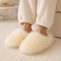 Woman wearing yellow shaggy plush closed-toe house slippers