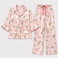Pink orchid-print satin pajama shirt and pants flat lay