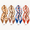 Reversible satin twilly scarves in orange, brown, blue and red floral prints